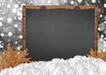 Blank blackboard with blurr forest and snow and leaves Royalty Free Stock Photo