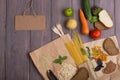 Blank blackboard, eco bags with products rich of complex carbohedrates: cereals, bread, pasta and vegetables Royalty Free Stock Photo