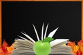 Blank blackboard, openned book and autumn maple