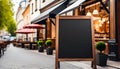 Blank blackboard restaurant shop sign or menu boards near the entrance to restaurant. Cafe menu on the street Royalty Free Stock Photo