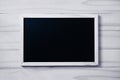 Blank blackboard on white wood background