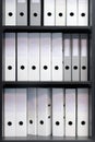 Blank blind folders with files in the shelf. Archival, stacks of documents in the book at the office with space for text Royalty Free Stock Photo