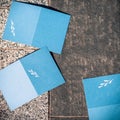 Blank blue cards on grey texture to replace your design, square