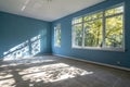 Blank blue empty room with sunlight and leaf shadows Royalty Free Stock Photo