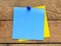 Blank blue memo card on a wooden table. A blank space to enter a note or insert graphics