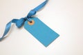 Blank blue price tag isolated on transparent background. Pastel color empty gift card and ribbon bow, PNG Royalty Free Stock Photo