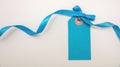 Blank blue price tag isolated on transparent background. Pastel color empty gift card and ribbon bow, PNG Royalty Free Stock Photo