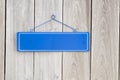 Blank blue sign on old rustic wooden fence Royalty Free Stock Photo