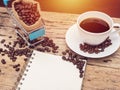 Blank book with copy space and a cup of fresh black hot coffee Royalty Free Stock Photo