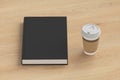 Blank book cover and coffee drinking cup