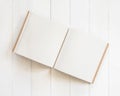 Blank book mockup open page template square-size recycle paper texture on white wood table