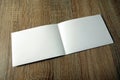 Blank booklet mockup on wooden background