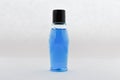 Blank  bottle, blue liquid Royalty Free Stock Photo