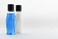 Blank  bottle, blue and whiteliquid Royalty Free Stock Photo