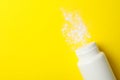 Blank bottle of talcum powder on background, space for text Royalty Free Stock Photo