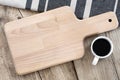 Blank breakfast board and coffee cup on a vintage table