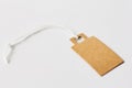 Blank brown cardboard price tag, sale tag, gift tag, address label on white background