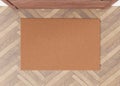 Blank brown door mat on the floor at home. Welcome mat with copy space for your text. Doormat mock up. Carpet at Royalty Free Stock Photo