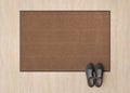 Blank brown door mat on the floor at home. Welcome mat with copy space for your text. Doormat mock up. Carpet at Royalty Free Stock Photo