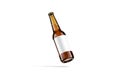 Blank brown glass beer bottle white label mockup, no gravity