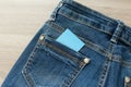Blank business card with copy space in a pocket of blue worn out jeans Royalty Free Stock Photo