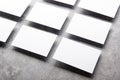 Blank business card mockups isolated on grey textured background. White namecard design mock up presentation. Empty horizontal