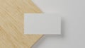 Blank business card over minimal wood and white material background