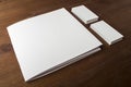 Blank business cards and booklet, brochure on a wooden background. For your design. Royalty Free Stock Photo