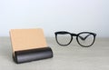 Blank business cards and glasses on wooden office table Royalty Free Stock Photo