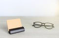 Blank business cards and glasses on wooden office table Royalty Free Stock Photo