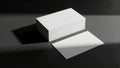 Blank business cards mock-up on a dark surface in a high-contrast black and white studio setting Royalty Free Stock Photo