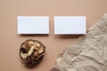 Blank business cards mock-up design with wooden decoration and crumpled craft paper Royalty Free Stock Photo