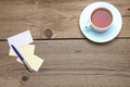 Blank business cards with pen and tea cup on wooden office table Royalty Free Stock Photo