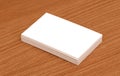 Blank business cards stacked up on a desk Royalty Free Stock Photo