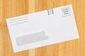 Blank business envelope on a wood desk mockup Royalty Free Stock Photo