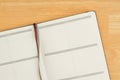 Blank business planner on textured desk wood background