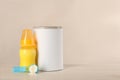 Blank can of powdered infant formula, feeding bottle and scoop on white wooden table, space for text Royalty Free Stock Photo