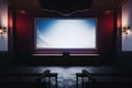 Blank canvas movie theater with an expectant and blank screen Royalty Free Stock Photo