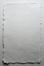 A Blank Canvas of White Paper Featuring a Torn Edge, Ideal for Creative Expression and Artistic Projects in Various Mediums Royalty Free Stock Photo