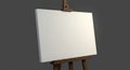 A blank canvas on a wooden easel stands against a dark gray background. The canva Royalty Free Stock Photo