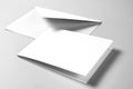 Blank card and envelope over grey background Royalty Free Stock Photo