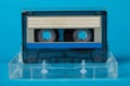 Blank cassette tape box with retro cassette on blue background