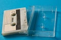 Blank cassette tape box with retro cassette on blue background