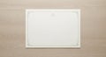 A blank certificate rests on a Royalty Free Stock Photo