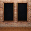 Blank chalkboard on brick wall Royalty Free Stock Photo