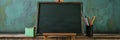A blank chalkboard on an easel with colorful pencils in a cup symbolizing education creativity new beginnings knowledge and Royalty Free Stock Photo