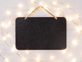 Blank Chalkboard sign with star string lights Royalty Free Stock Photo