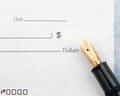 Blank check and fountain pen Royalty Free Stock Photo