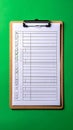 Blank Checklist Form on a Clipboard with Green Screen Royalty Free Stock Photo