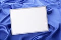 Blank Christmas greetings card or invitation with blue satin background Royalty Free Stock Photo